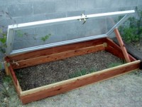 DIY Cold Frame made from a reused storm door and redwood 